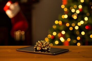 Digital table with ribbon on wooden table