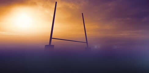 Flat design illustration showing foggy dawn field with goalposts and crossbar under glowing sun © vectorfusionart