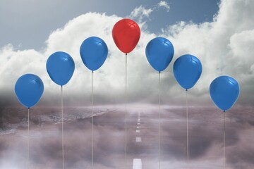 Red balloon is floating among six blue balloons over foggy road in flat design, copy space