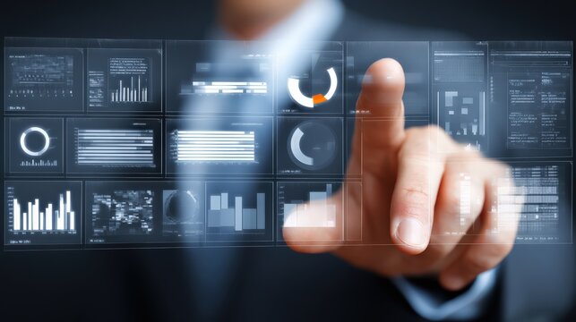 A person interacts with a futuristic transparent digital interface displaying various charts, graphs, and data analytics.