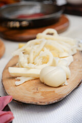 Freshly prepared ingredients on a wooden board for cooking
