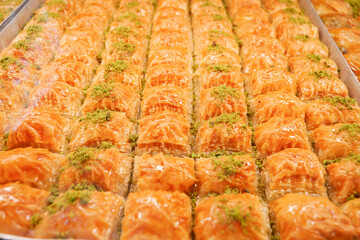 Traditional baklava displayed at a market in the afternoon