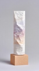 Textured White Sculpture on Tan Base