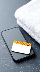 Top View of Smartphone with Blank Tag and White Towels