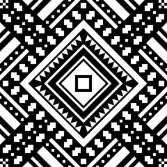 A bold monochrome seamless pattern created from traditional tribal pixel motifs in black and white.