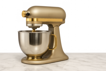 Gold stand mixer with stainless steel bowl on marble countertop with transparent background