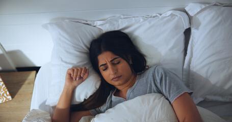 Comfortable, fatigue and sleeping with woman in bed for morning or weekend break and wellness....