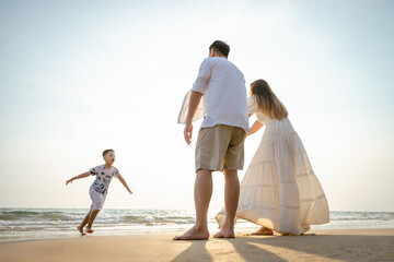 Family holiday vacation beach. Asian happy family outdoors summer travel. Fun families outdoors. Family vacation beach.