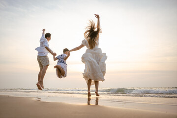 Family holiday vacation beach. Asian happy family outdoors summer travel. Fun families outdoors. Family vacation beach.