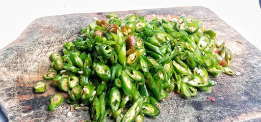 Close up landscape photo of a pile of thinly sliced green chilies