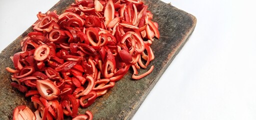 Close up landscape photo of a pile of red melinjo skins 