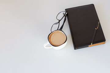 Office supplies and a cup of coffee on the desk. Planning.