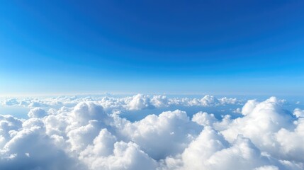 Fototapeta premium Expansive view of clouds and a vibrant blue sky