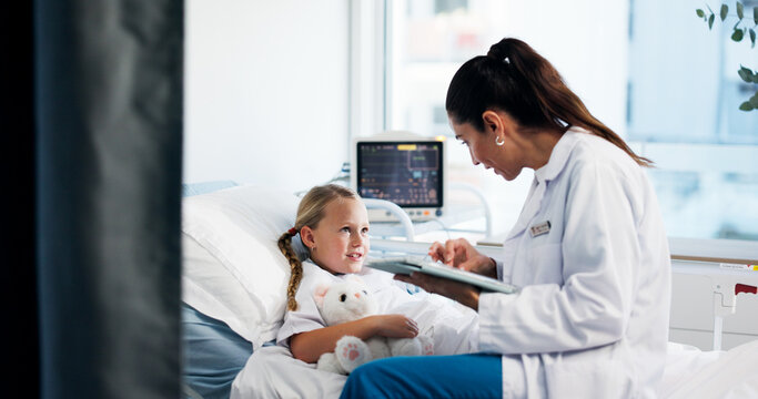 Hospital bed, talk and doctor on tablet with girl for medical service, consulting and treatment. Healthcare, pediatrician and woman on tech with child for surgery, results and patient diagnosis