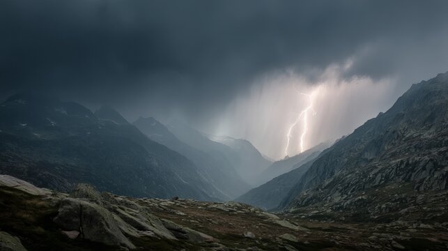 Dramatic thunderstorm over grimsel mountain pass with dark clouds and lightning