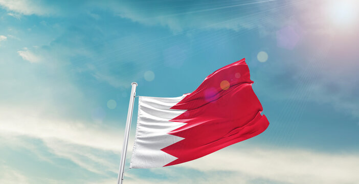 Bahrain national flag waving with beautiful sky. 