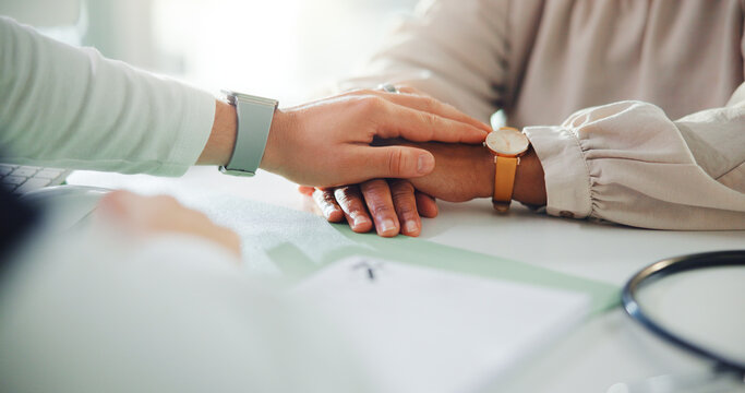 Doctor, patient and hands with comfort for empathy, understanding or trust at clinic office. Healthcare, medical worker or client with touch for sympathy, breaking news or health support at hospital