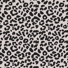 Leopard skin seamless pattern with natural, swirling animal black spots, on a light beige background. Animal classic fur illustration. Cheetah leather endless print design.