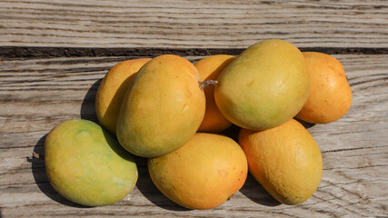 Tasty Mango fruits. Yellow color mango on table