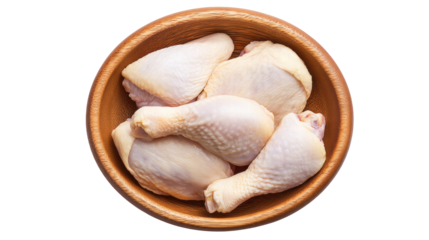 Raw chicken drumstick and thigh isolated on transparent background in wooden bowl
