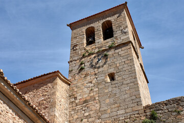 Bell tower of the Church of Santa Maria de Aguas Vivas in Hervas, Extremadura, with its clock and...