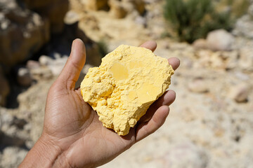 Obraz na płótnie Canvas Holding uranium ore in a natural setting Generative AI