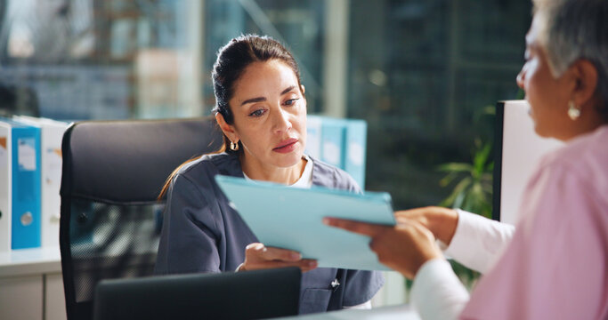 Nurse, admin and discussion with document at reception for medical report, schedule or records. Folder, healthcare team or paper in clinic with women for results, feedback or surgery info for surgeon