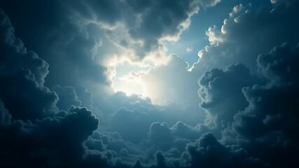 A dramatic sky filled with dense, dark clouds illuminated by a bright light breaking through from above.