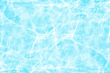 Blue water with ripples on the surface. Defocus blurred transparent blue colored clear calm water surface texture with splashes and bubbles. Water waves with shining pattern texture background.