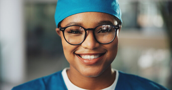 Portrait, doctor or black woman with smile for surgery, medical career or wellness in hospital. Happy, face or proud female surgeon with scrubs or confidence for healthcare services, medicine or help