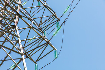 A tall power tower with green and clear bottles on it