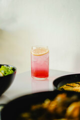 Campari Tonic is made by combining Campari, an Italian bitter liqueur, with tonic water.