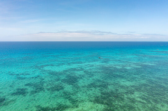 Tropical seascape with blue sea surface with coral reefs in Bantayan, Cebu. Philippines. - Powered by Adobe