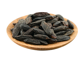 closeup pile of tonka bean in wood bowl cutout