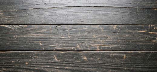 Distinct grain waves, layered paint loss, and surface distressing bring visual depth and authenticity to this vintage black wood backdrop.