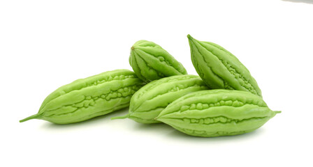 Green vegetable bitter melon placed on a white table 