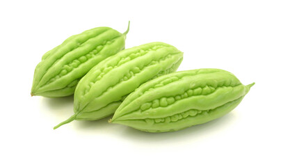 Slices of bitter melon (gourd), on a white cut out background