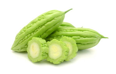 Green vegetable bitter melon placed on a white table 