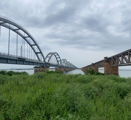 Fototapeta premium Historic bridges over godavari river andhra pradesh india landscape view a bowstring-girder bridge, the longest of its kind in Asia, and the latest of three bridges spanning the Godavari River