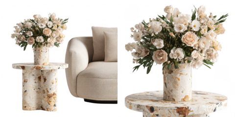 Cream-colored flowers in a textured vase on a side table, next to a cream-colored sofa