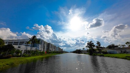 Bright sunlight under water with building on background
