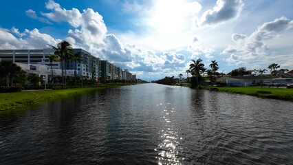 Bright sunlight under water with building on background