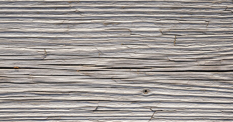 Parallel grain structure interrupted by dark cracks and random scrapes across dry wooden planks with fading surface hues.