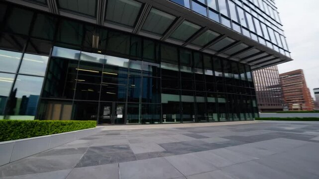 Modern architecture captured in a bustling urban area with sleek glass buildings and vibrant greenery