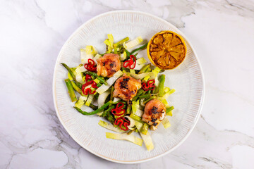 Calamari with salad and red peppers