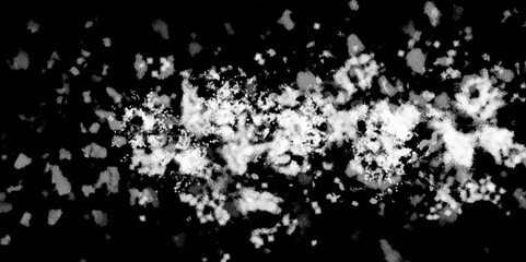 Snowflakes on dark background. white icy snowflakes isolated on black background, natural background. white crystalline powder on a black background. sugar dust. texture, pattern and clipping.