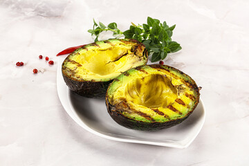 Sliced fresh avocado on the grill