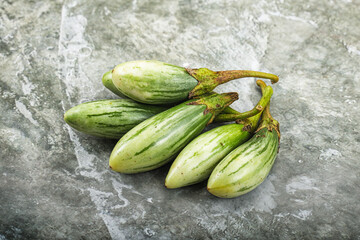 Small organic young green eggplant