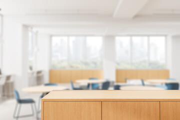 Wooden tabletop in focus with modern office interior blurred in background for product display or mockup presentation concept scene setup. 3D Rendering