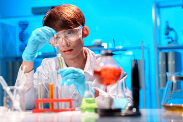 Young Scientist Conducting Experiment in Modern Laboratory Setting
